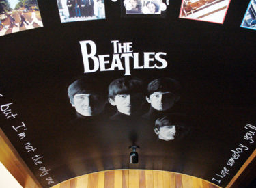 Trompe l’oeil Beatles mural on arched ceiling
