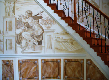 Panoramic trompe l’oeil mural and marbled panels in elegant foyer