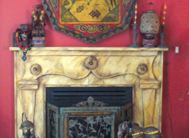 Fauxstone fireplace over original wood