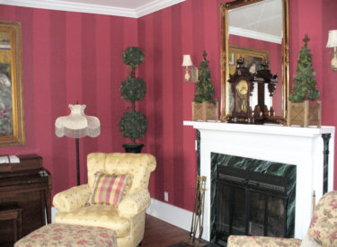 Dramatic striping and faux marbled fireplace